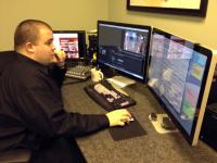 Intern Ted Gulyas from George Mason University at the edit console.
